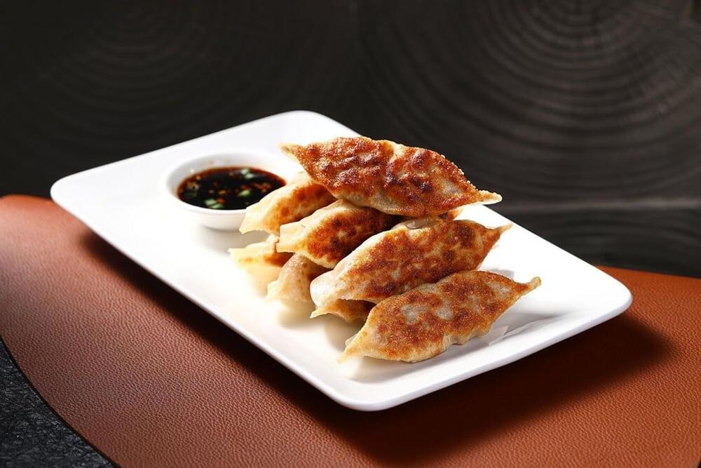 #7. Pork Dumplings (8 pcs)